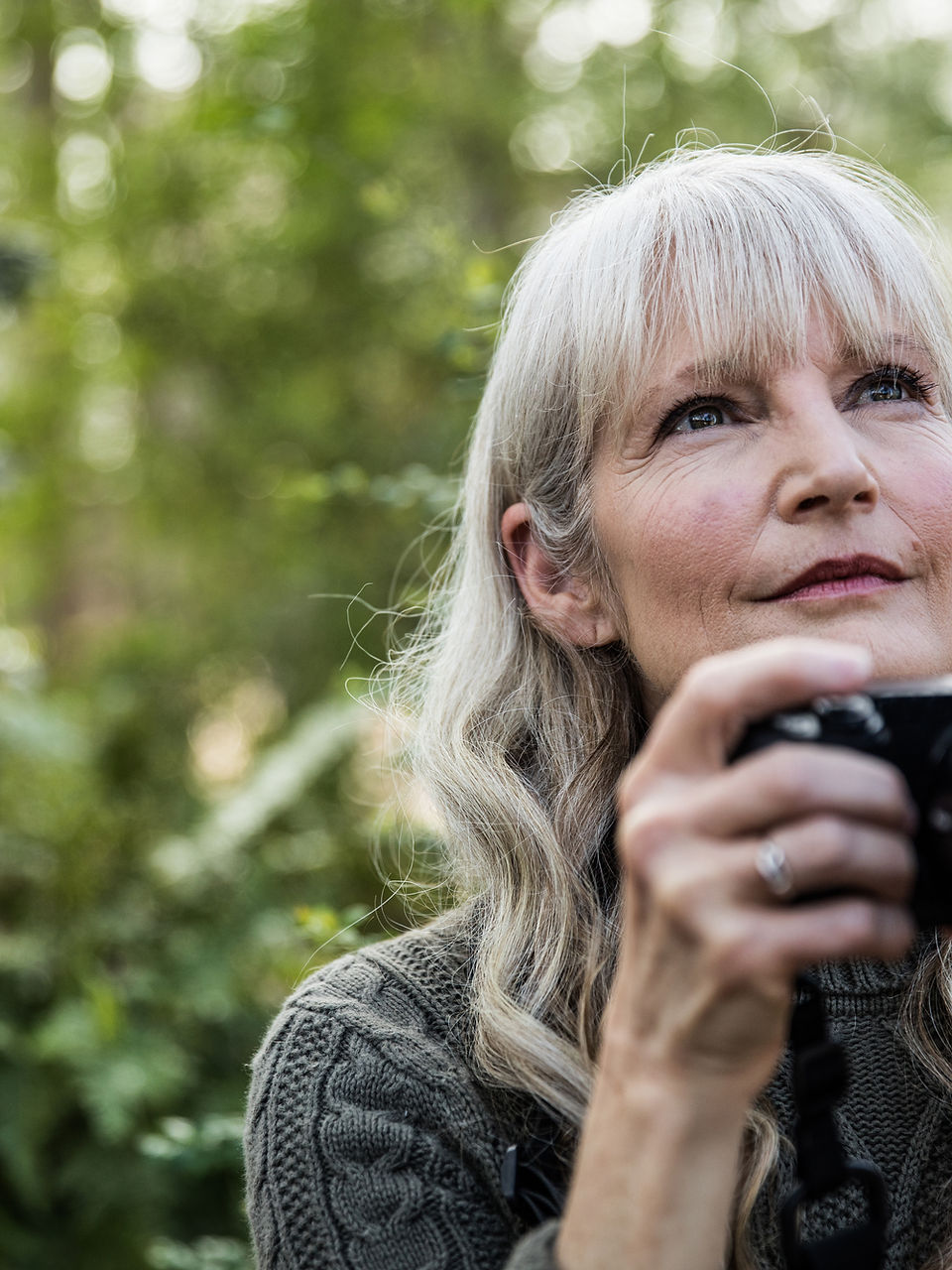 Surve Wellness a woman holding a camera