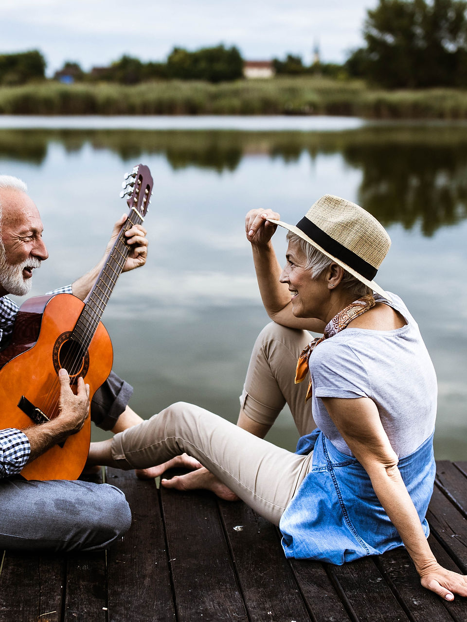 Surve Wellness a man singing with a guitar for a lady.